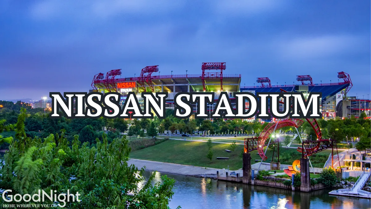 A panoramic exterior view of Nissan Stadium beside the river, with city bridges and green park spaces in the foreground. The stadium's recognizable structure shines, and the surrounding area buzzes with the anticipation of game days and gatherings.