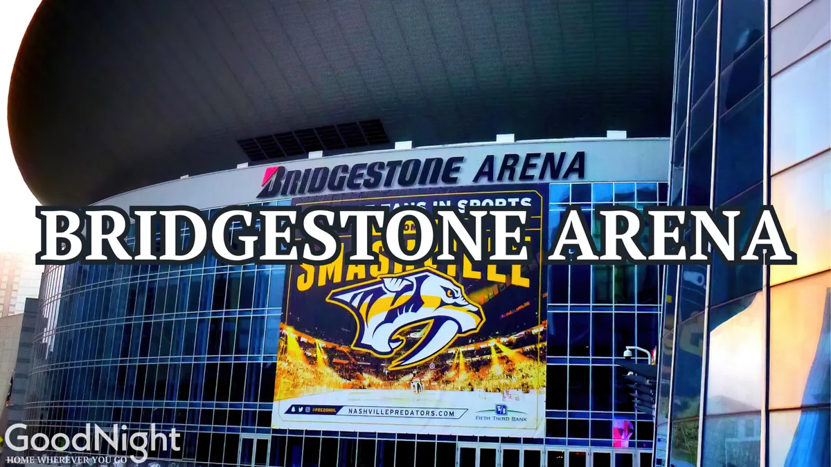 A dynamic exterior shot of the Bridgestone Arena, featuring its sleek facade, large glass windows, and a prominent Nashville Predators banner. The bustling activity around the entrance conveys the excitement of game nights and live events.