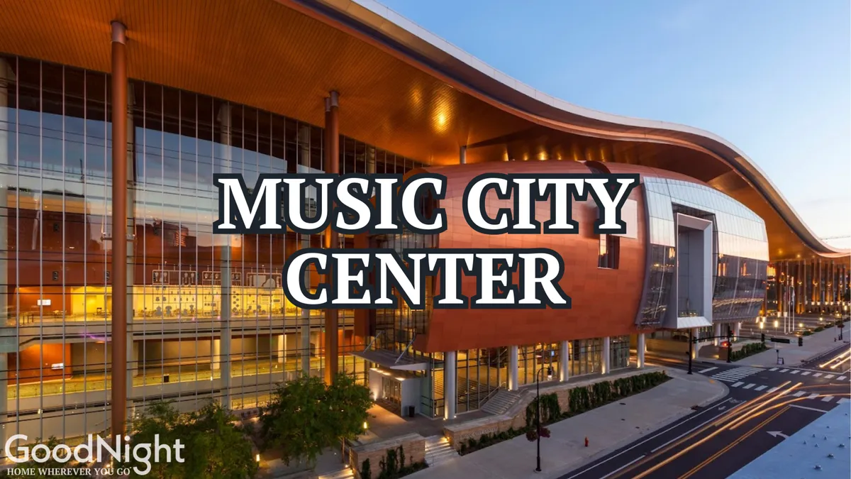 This exterior image showcases the Music City Center building, surrounded by lively city streets and well-maintained greenery. The scene conveys the energetic atmosphere of downtown, highlighting a central destination for business travelers due to its proximity to major offices, conferences, and events.